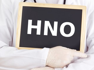 Doctor shows information on blackboard: otolaryngology