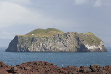 View from Vestmannaeyjar / Heimaey of the neighboring island.