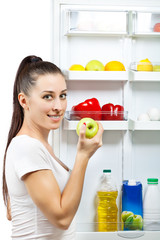 attractive girl near the open refrigerator