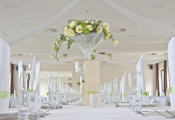 Wedding table with bouquet of roses