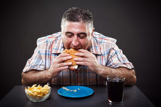 Greedy Man Eating Burger