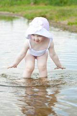 Little girl playing in water