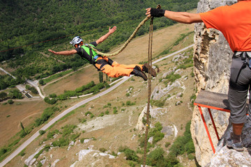 Jump off a cliff with a rope.