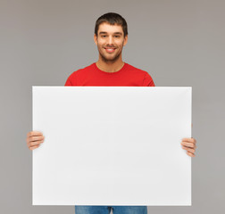 handsome man with big blank board