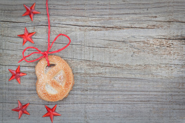 Christmas cookies and star on the tape. On textured wood.