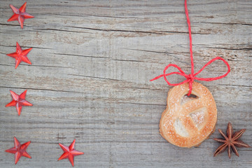 Christmas cookies and star anise. On textured wood.