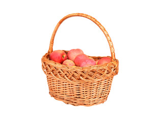 Red apple in a wattled basket, isolated on white background