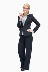 Thinking businesswoman standing