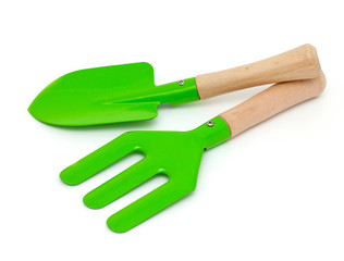 green garden shovel and rake