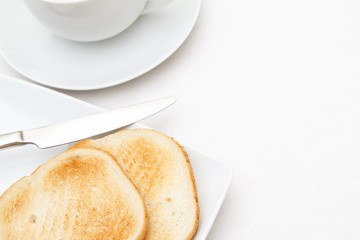 Slices of toast with a cup and saucer