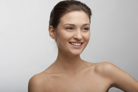 portrait of a beautiful smiling girl with perfect skin
