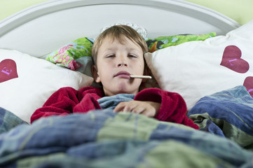 Boy in bed with the flu