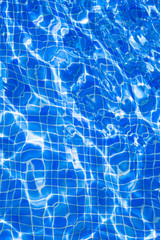 Blue tiels pool with ripple water reflection