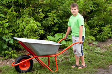 The boy with the empty wheelbarrow