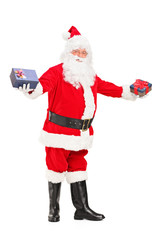 Full length portrait of a Santa Claus offering gifts