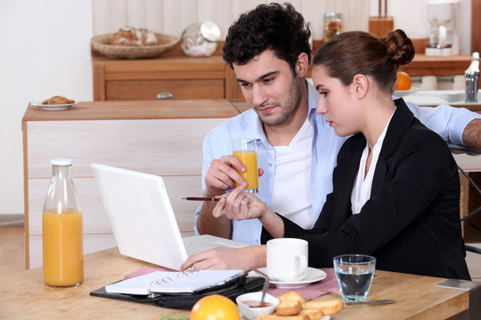 Woman going over a work presentation with her boyfriend - Powered by Adobe