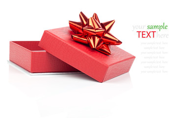 Single red gift box with red ribbon, on white background.