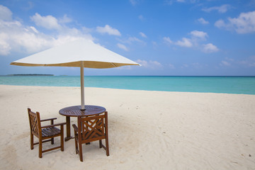 table with chairs at the beach