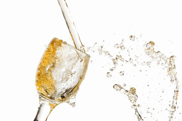 White wine pouring into glass