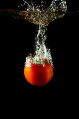 fresh tomato under water