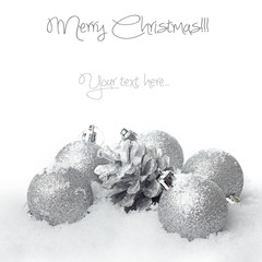 Christmas ball baubles with silver decoration on the snow 