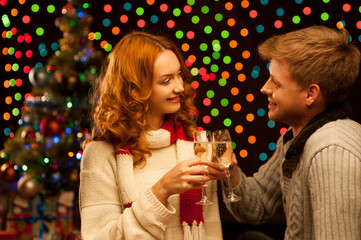 young happy smiling casual couple with wineglasses