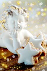 angel with cinamon cakes and glitter