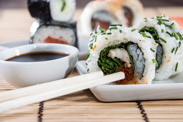 Sushi rolls with sticks and Soy Sauce