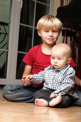 Little boy playing with a brother