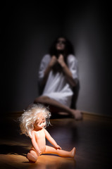 Crazy girl and plastic doll