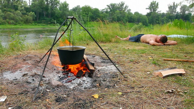 camping - kettle over campfire