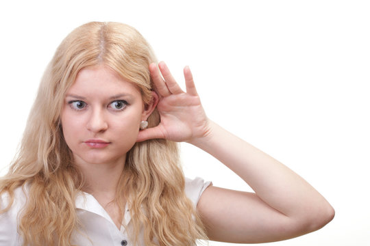 woman eavesdropping with hand behind her ear