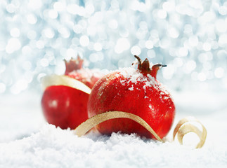 Red pomegranates with party lights