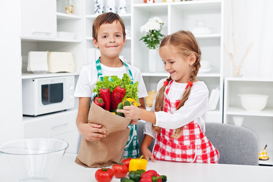 Kids Unpacking The Groceries