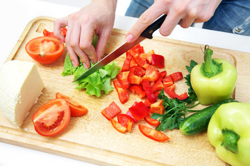 Hands  cooking vegetables salad