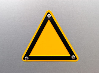 Empty warning sign on a metal surface