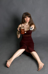 Girl with the panel from the TV and a glass of beer