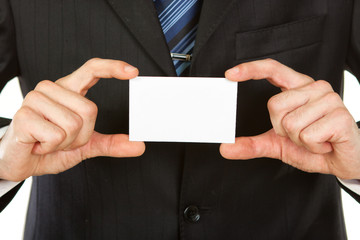 Fototapeta premium Image of a businessman holding a blank in the hand. Isolated on