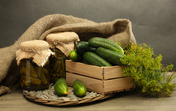 fresh cucumbers in wooden box, pickles and dill,