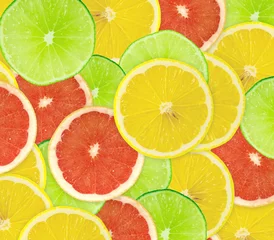 Fotobehang Abstracte achtergrond van citrusvruchtenplakken. Detailopname. Studiofoto © oly5