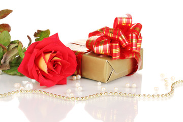Beautiful red rose with wonderful gift in gold box isolated