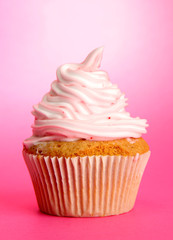 tasty cupcake, on pink background