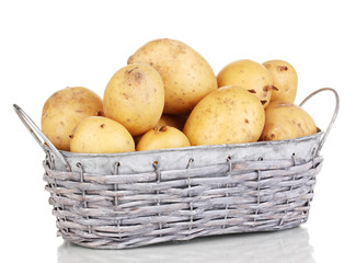 Ripe potatoes on basket isolated on white