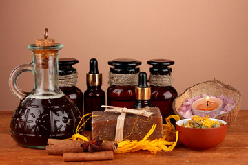 ingredients for soap making on brown background