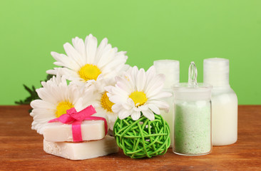 Obraz na płótnie Canvas ingredients for soap making on green background