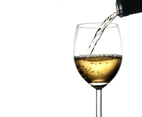 Pouring wine into glass isolated on white