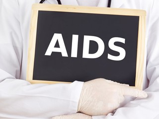 Doctor shows information on blackboard: aids
