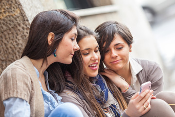 Obraz premium Group of Women Sending Message with Mobile Phone