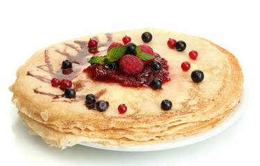 Delicious pancakes with berries and jam