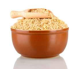 brown rice in a brown plate , isolated on white